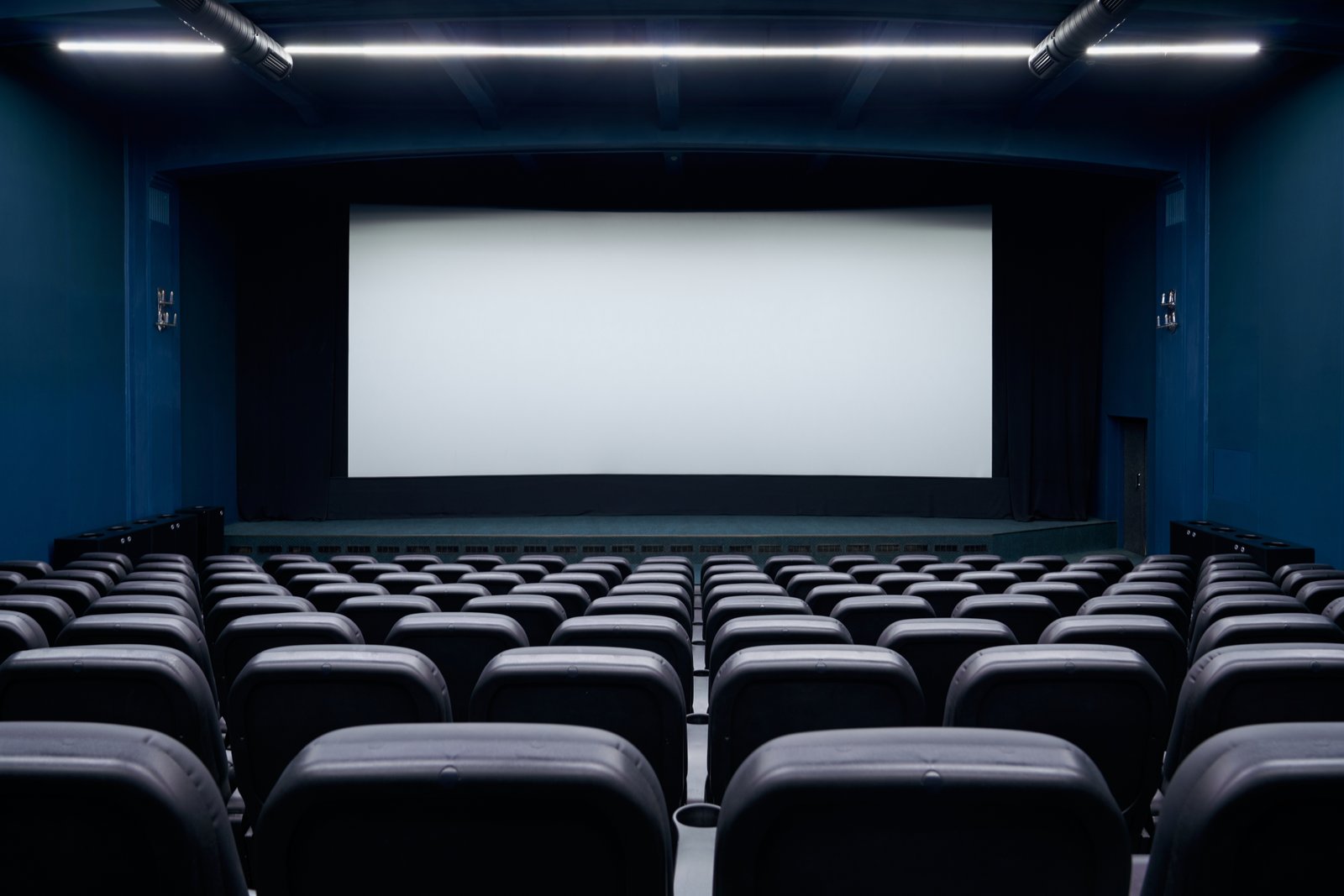 Empty movie theater with a large screen